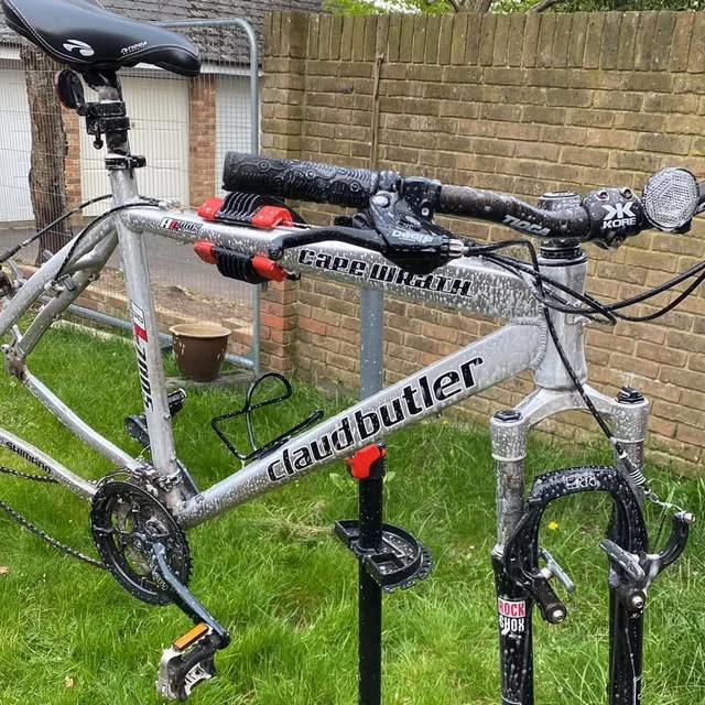 A Claud Butler hybrid bike on the stand at JJW Bicycle Repairs