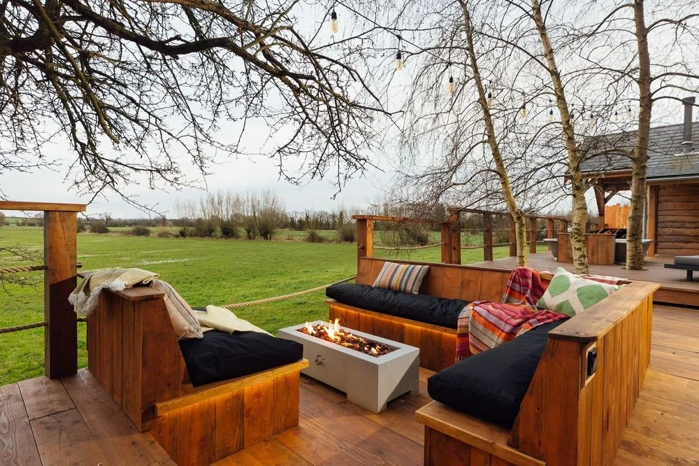 Outdoor seating overlooking the fields at a With Bear Hands retreat